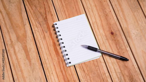 blank white paper notes with pen on top wood table