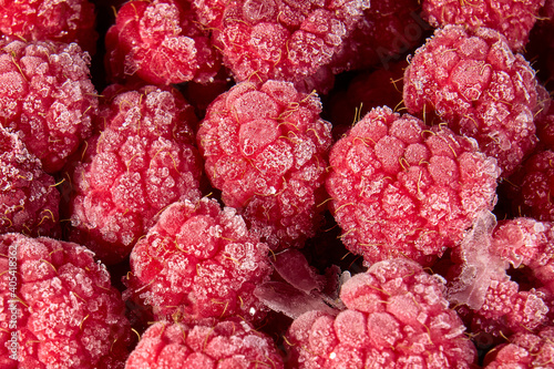Frozen berries of raspberries, covered with hoarfrost. Close-up