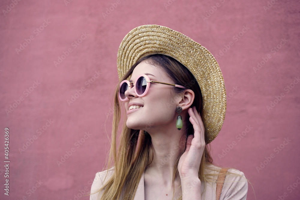 Cheerful woman walking through the city travel on the background of the wall Cheerful woman walking through the city travel on the background of the wall