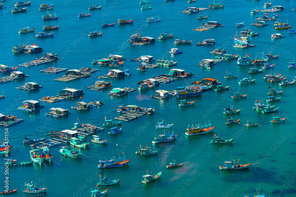 Aerial view of traditional fishermen boats lined in An Thoi harbor of Duong Dong town in the popular Phu Quoc island, Vietnam, Asia.