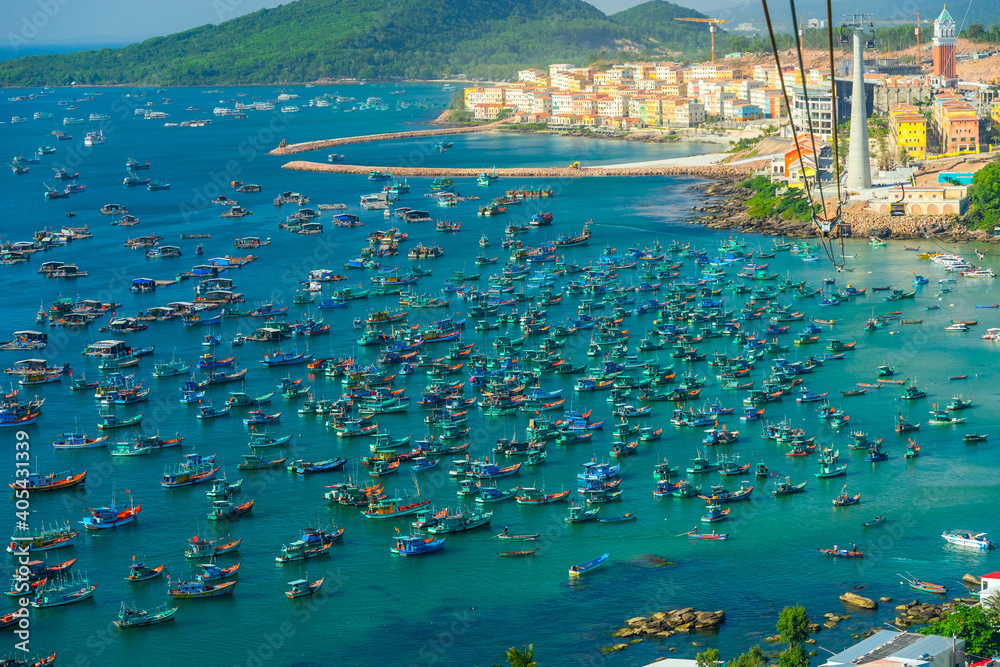 Fototapeta premium Aerial view of traditional fishermen boats lined in An Thoi harbor of Duong Dong town in the popular Phu Quoc island, Vietnam, Asia.