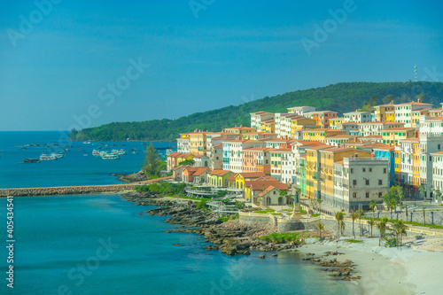 Aerial view of Phu Quoc city with beautiful houses, buildings and coast line. Tropical village in Phu Quoc island, Vietnam, Asia.