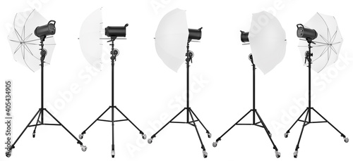 Photography studio lighting stand with flash and umbrella isolated on white