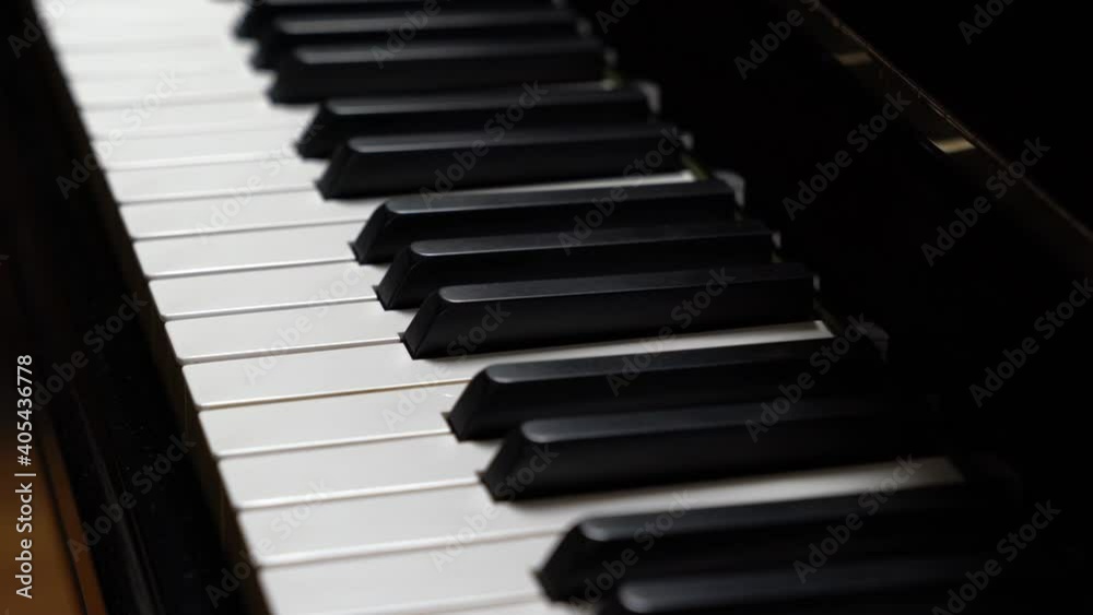 Closeup of black grand piano, panning shot Closeup of black grand piano, panning shot