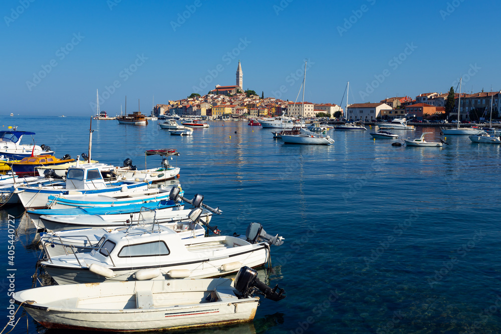 fishing boats moored at the pier in harbour of Rovinj town, Croatia.