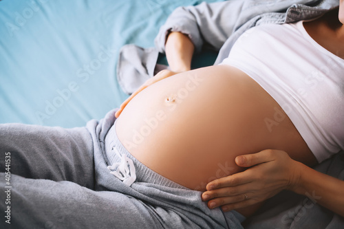Close-up of woman pregnant belly. Pregnancy concept.