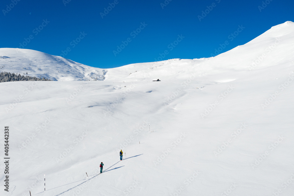 Aerial drone photograph with skier touring in Bucegi mountains, Carpathian range, Romania