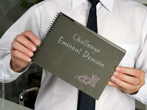 Business concept about Challenge Eminent Domain with phrase on the piece of paper.