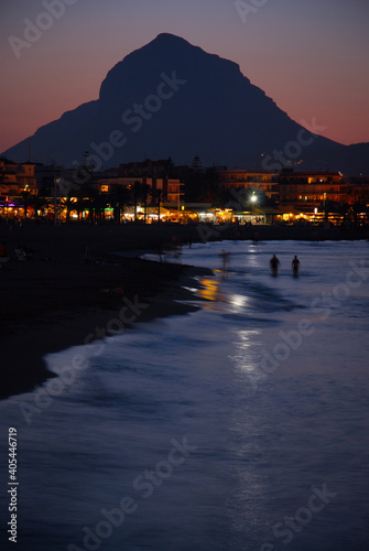 Sunset view of Arenal beach and Montgo mountain, Javea, Alicante Province, Valencia, Spain photo