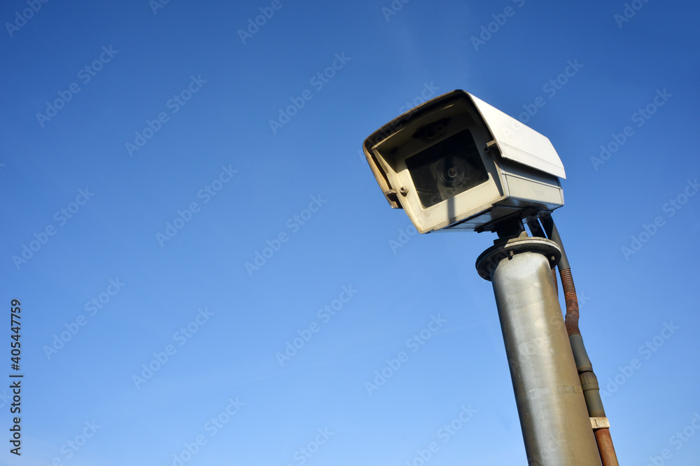Surveillance camera in blue sky outdoor