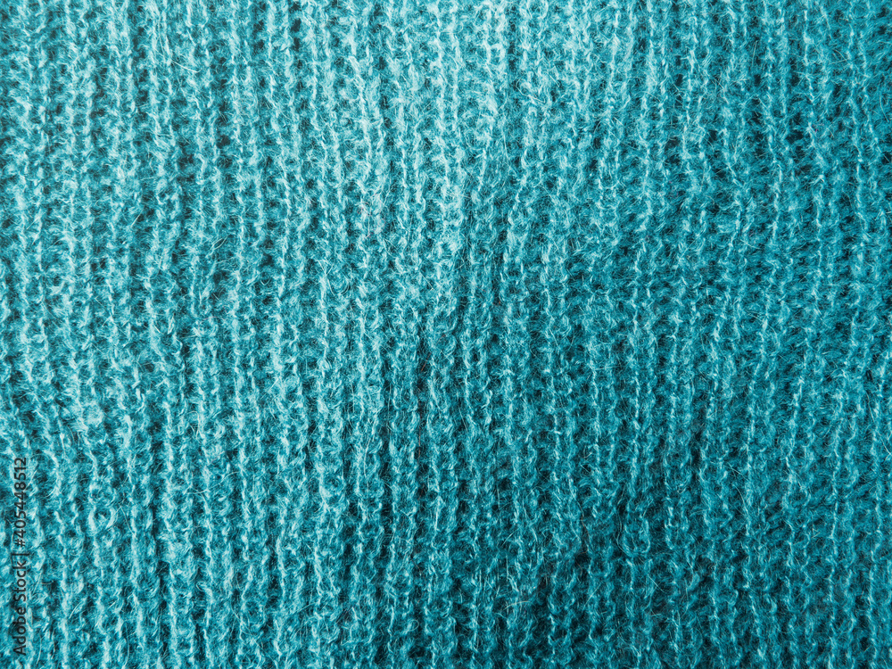 Blue tuquoise woolen sweater, macro texture background Blue tuquoise woolen sweater, macro texture background