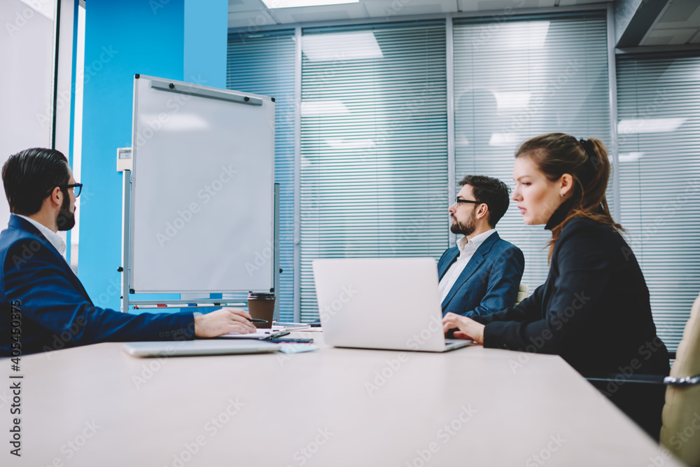 Focused colleagues brainstorming in office Focused colleagues brainstorming in office