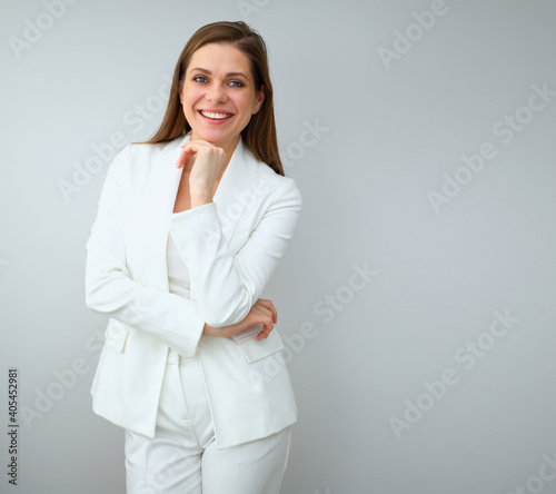 Buisness woman in white suit standing near to copy spase.
