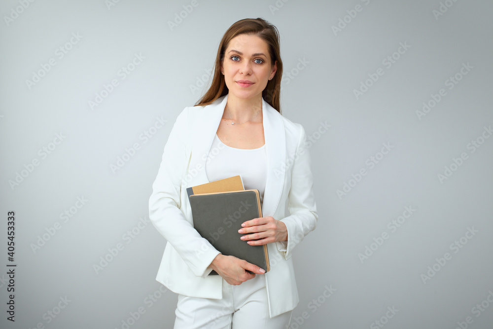 Confident woman teacher or business woman with books or business paper Confident woman teacher or business woman with books or business paper