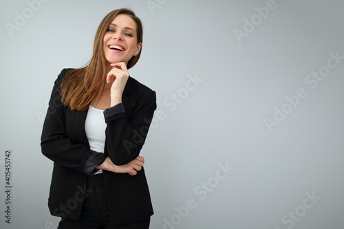 Business woman with big toothy smile dressed black suit.