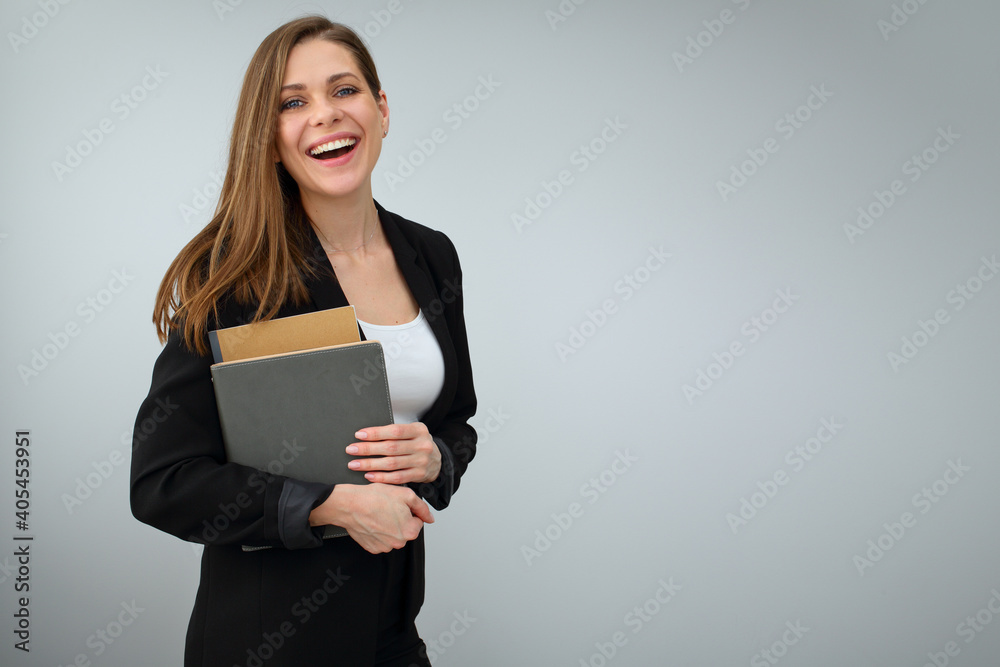 Woman teacher wearing black business suit holding work book. Woman teacher wearing black business suit holding work book.