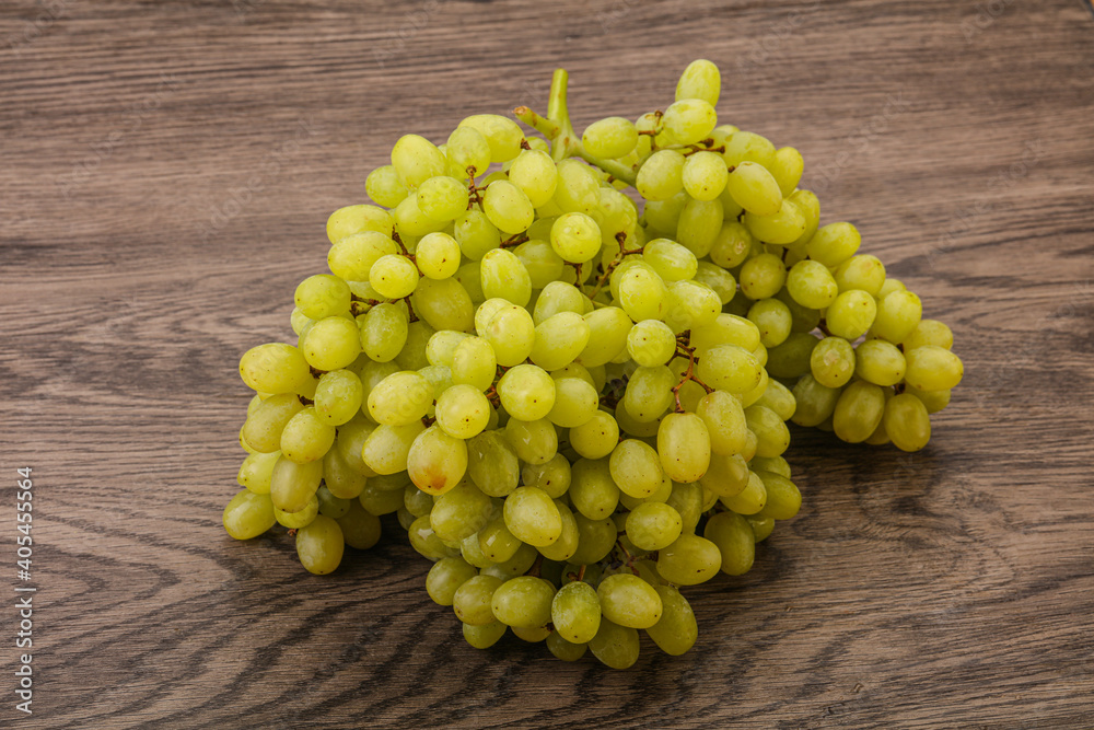 Green grape branch over background Green grape branch over background