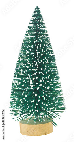 Green artificial tree in the snow isolated on a white background close-up.