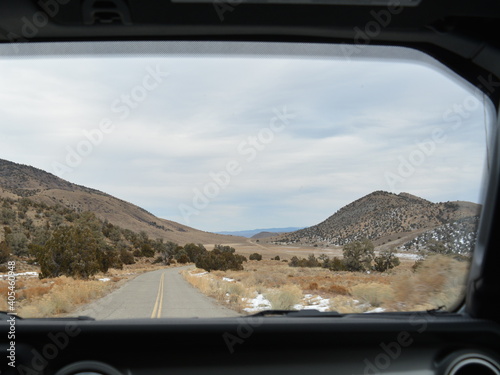 view through the windshield of a car - paved road in the Death Valley National Park