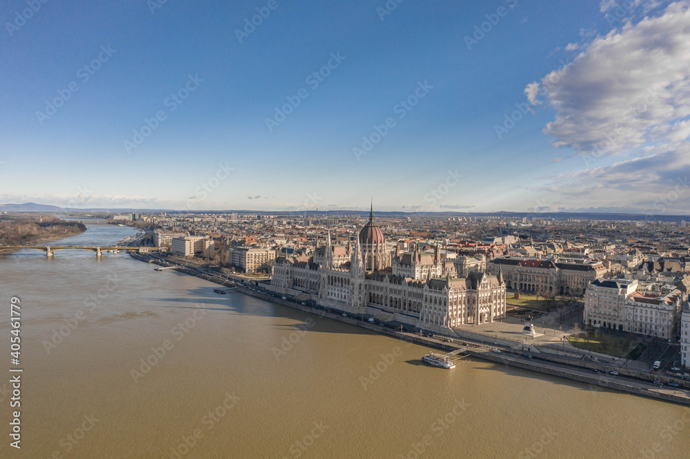 Aerial drone shot of Hungarian Parliament with overcast clouds in Budapest Winter morning