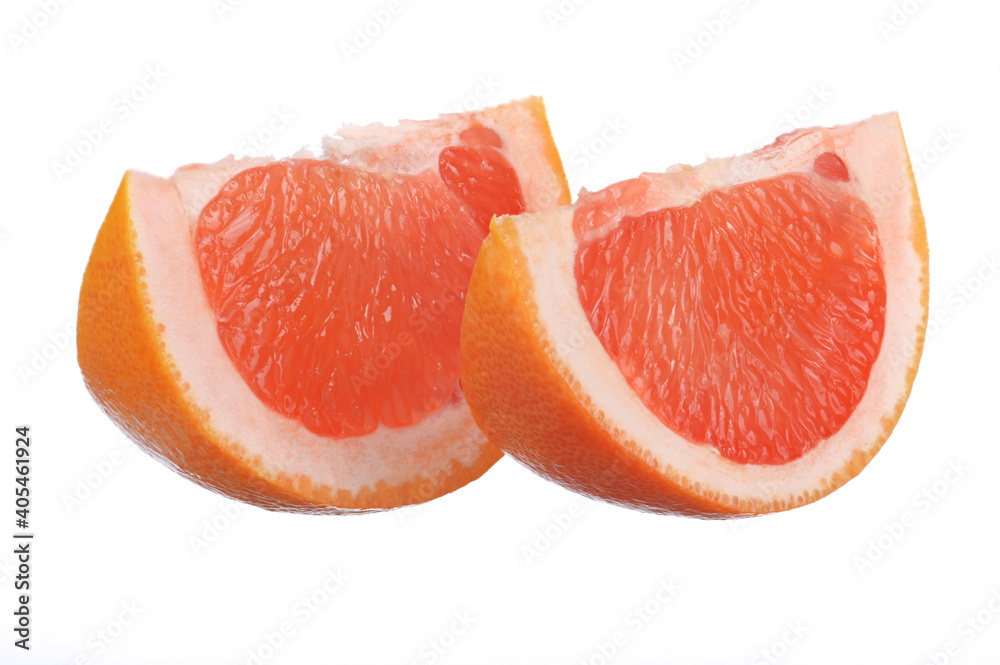 two juicy, fresh grapefruit slices on a white isolated background two juicy, fresh grapefruit slices on a white isolated background