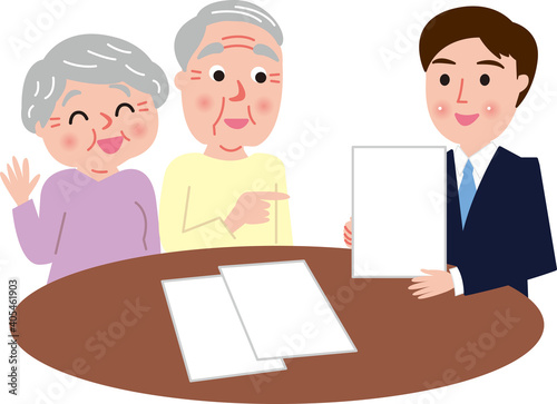 打ち合わせをするシニア夫婦と若い男性担当者