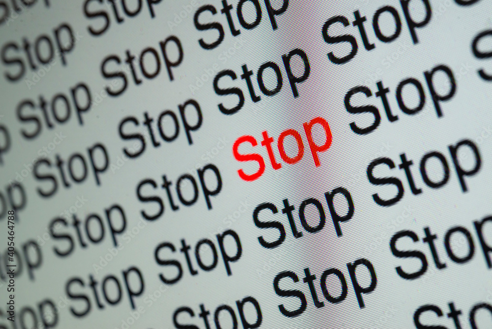 Stop, red and black words forming a texture on a computer monitor
Stop, red and black words forming a texture on a computer monitor