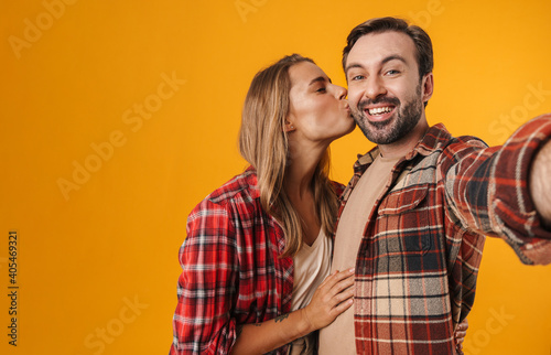 Portrait of a cheerful young couple embracing