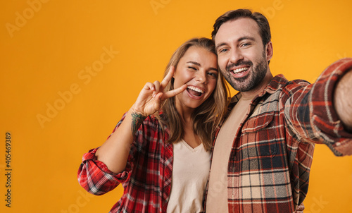 Portrait of a cheerful young couple embracing