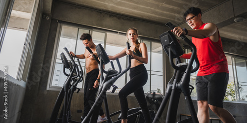 Group of Athletic Sports Running on a Treadmills at fitness club for wellness health. People at gym to build muscle and body strength. Exercise training concept.