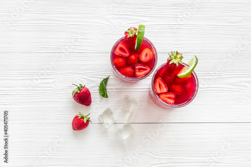 Strawberry cocktail or lemonade with ice and mint. Cold red drink