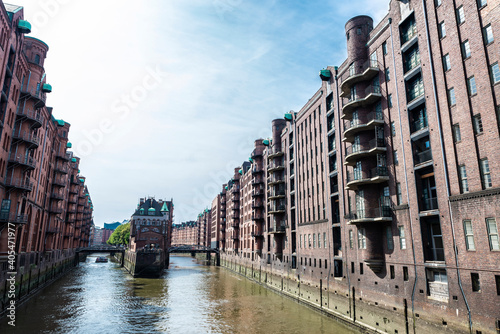 Fototapeta Naklejka Na Ścianę i Meble -  Old warehouses next to a canal in HafenCity, Hamburg, Germany