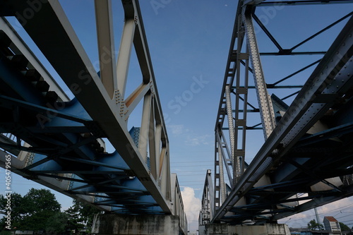 The railway bridge is visible from under the backdrop of the beautiful blue sky.