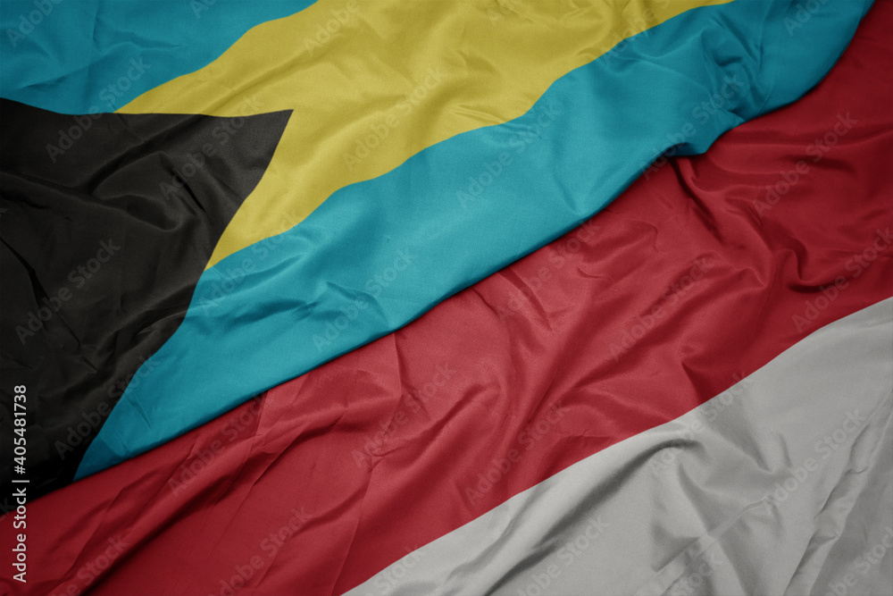 waving colorful flag of indonesia and national flag of bahamas. waving colorful flag of indonesia and national flag of bahamas.