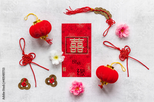 Chinese New Year decorations top view. Red lanterns and postcard with chatacter means double happiness photo