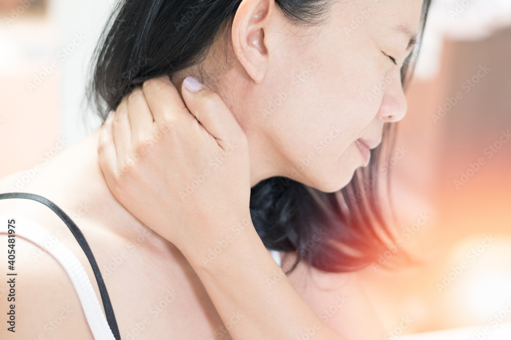 Polymyalgia,rheumatican neck pain disease concept. Asian female hand on her neck as suffering from office syndrome neck ache Polymyalgia,rheumatican neck pain disease concept. Asian female hand on her neck as suffering from office syndrome neck ache