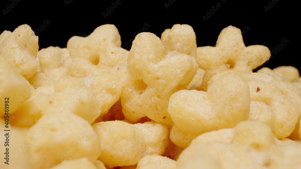 MACRO: Sweet corn stars on a black background MACRO: Sweet corn stars on a black background
