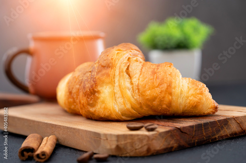 Delicious snack croissant on black background