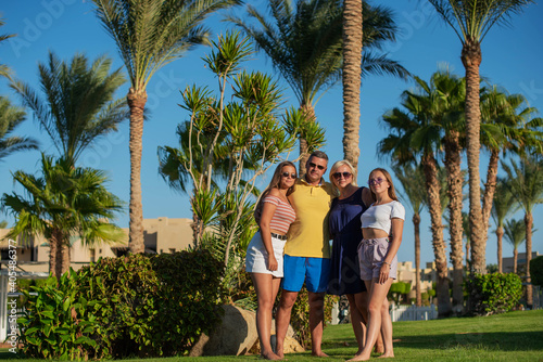 Real people concept, beautiful family, two teenage girls, mother and father happiness and nice body for enjoyed people live an lifestyle, smile and walk together in vacation. © MartaKlos