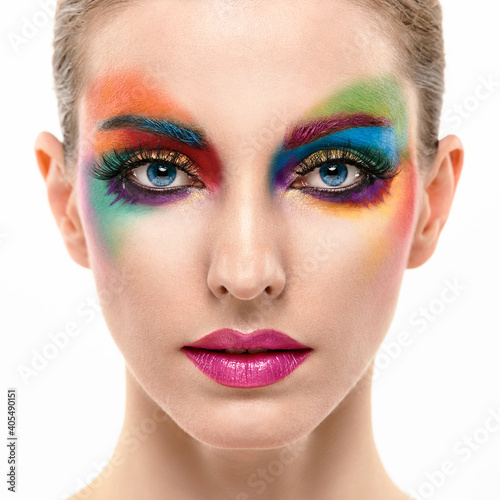 Beauty Fashion woman with Colorful Bright Makeup, sleek Hairstyle. Girl with blue eyes, stylish hair and make up. Beautiful model portrait, fashionable color trend make up.