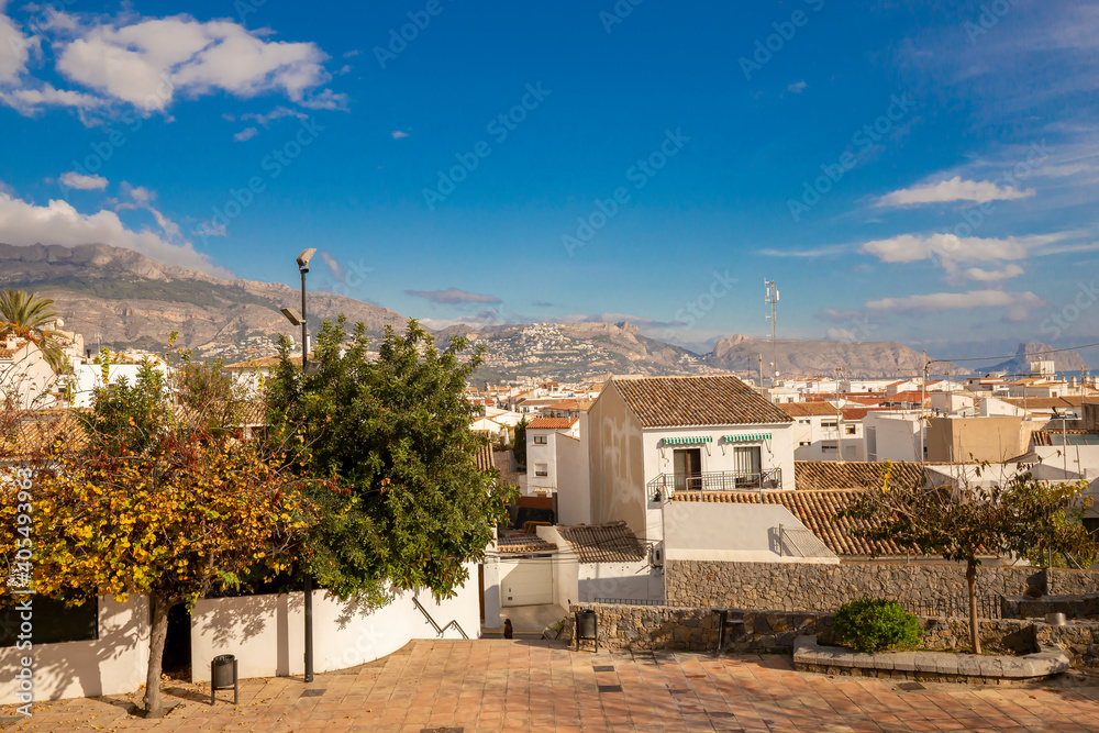 Panoramic view of the city of white houses with tiled roofs, mountain range and sea, old town in Altea Spain