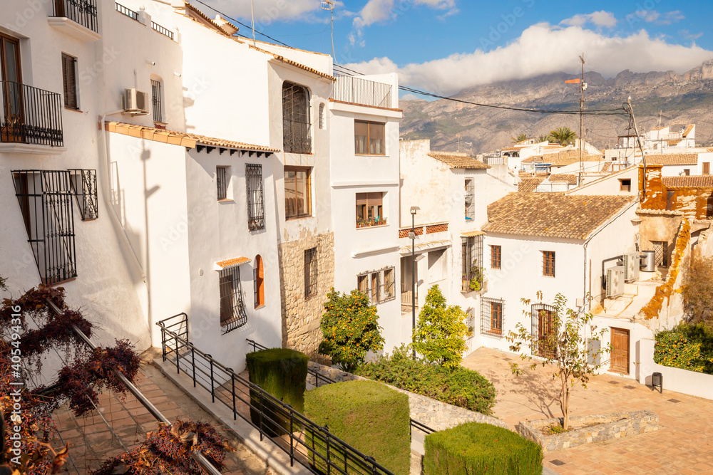 City view from white houses with tiled roofs, mountain range, old town in Altea, Spain