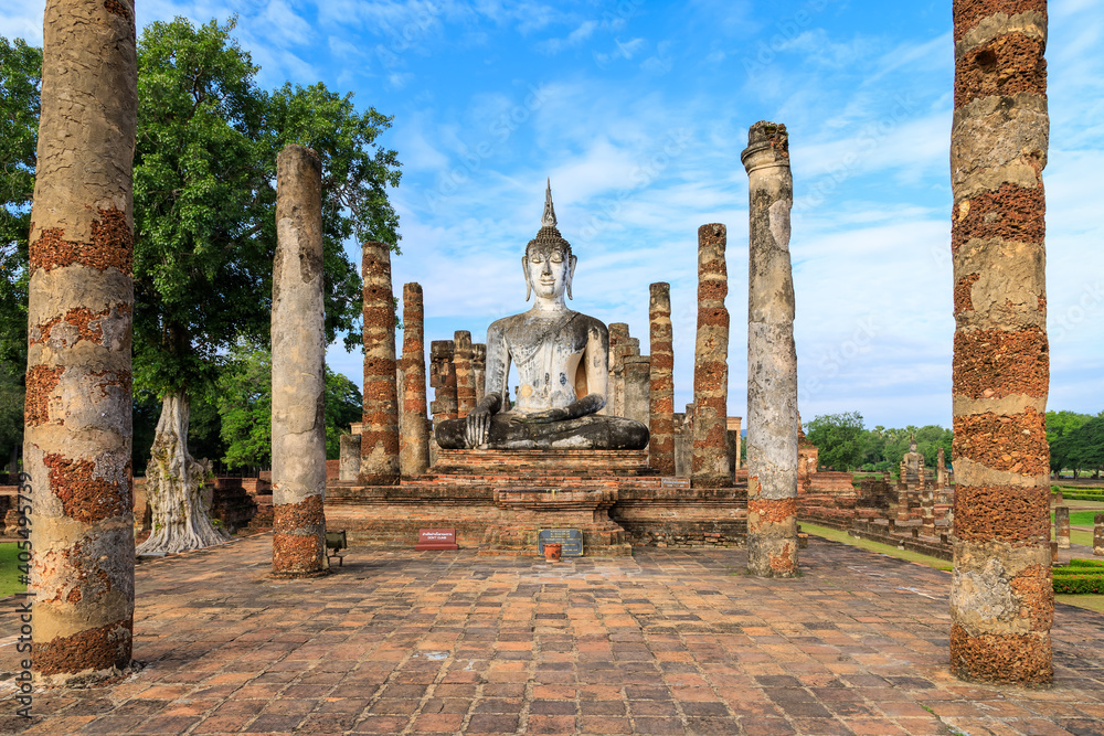 Buddha statue in ruined chapel in monastery complex at Wat Mahathat temple, Sukhothai Historical Park, Thailand
