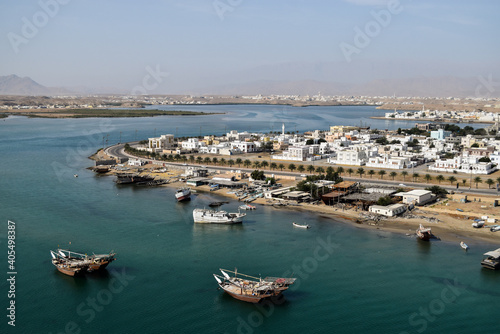 Aerial view of Sur and the boats on the sea. Picture was taken from the top of the mountain. Oman. © marisa
