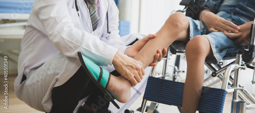 Doctor checking disabled person pateint leg at hospital  Muscle weakness