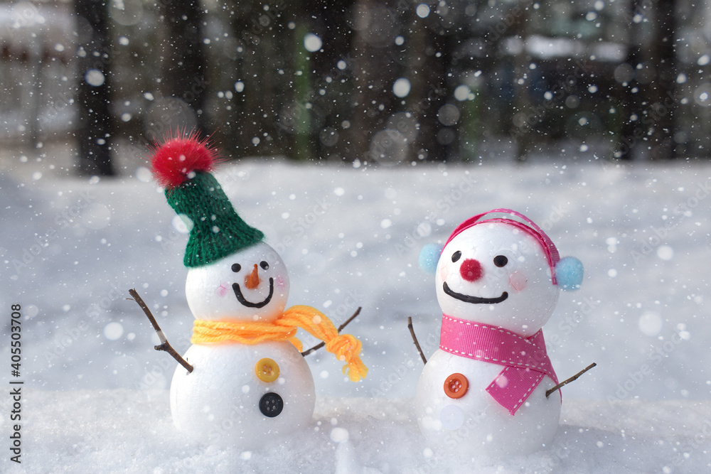 cute snowman standing on snowy field in winter. cute snowman standing on snowy field in winter.