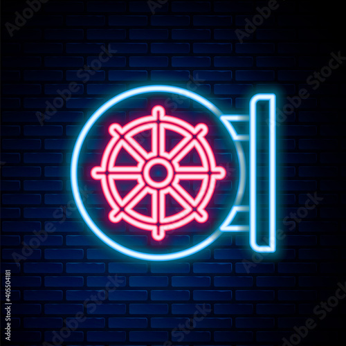 Glowing neon line Dharma wheel icon isolated on brick wall background. Buddhism religion sign. Dharmachakra symbol. Colorful outline concept. Vector.