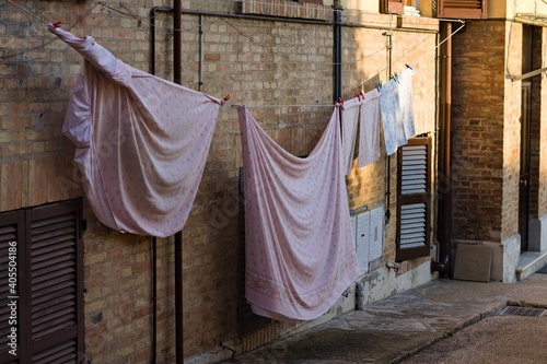 Sheets spread out on the street in an Italian village (Pesaro, Italy, Europe) © Tommaso
