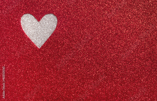 Valentines day background. Heart shape made of sparkle red paper. Minimal creative composition. Top view  flat lay  copy space
