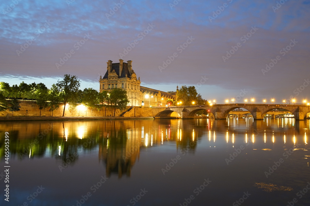 Twilight over the river Seine and Louvre museum in Paris